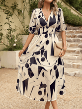 HIDDEN PASSAGE PRINTED MIDI DRESS - BEIGE